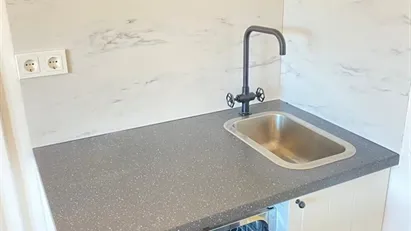 Bed in a quadruple room in Herbersteinova Apartment